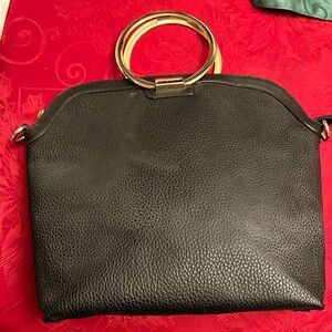Ring handle black bag. No cross body strap included